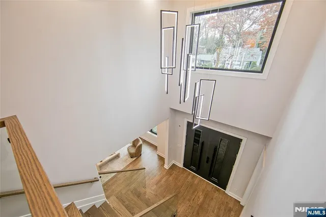 a spacious bedroom with a large bed and a large window