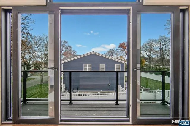 a view of a two chairs in the patio