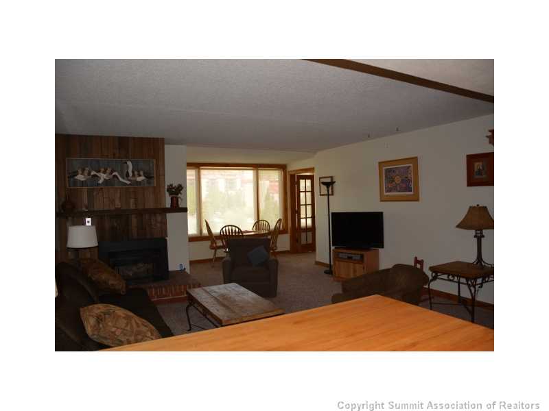 88 Guller Road, Unit 406 Frisco, CO 80443 - Photo 4 of 25 Living Room. The living room & dining area with gas fireplace ~ gas & heat are included in the HOA dues.