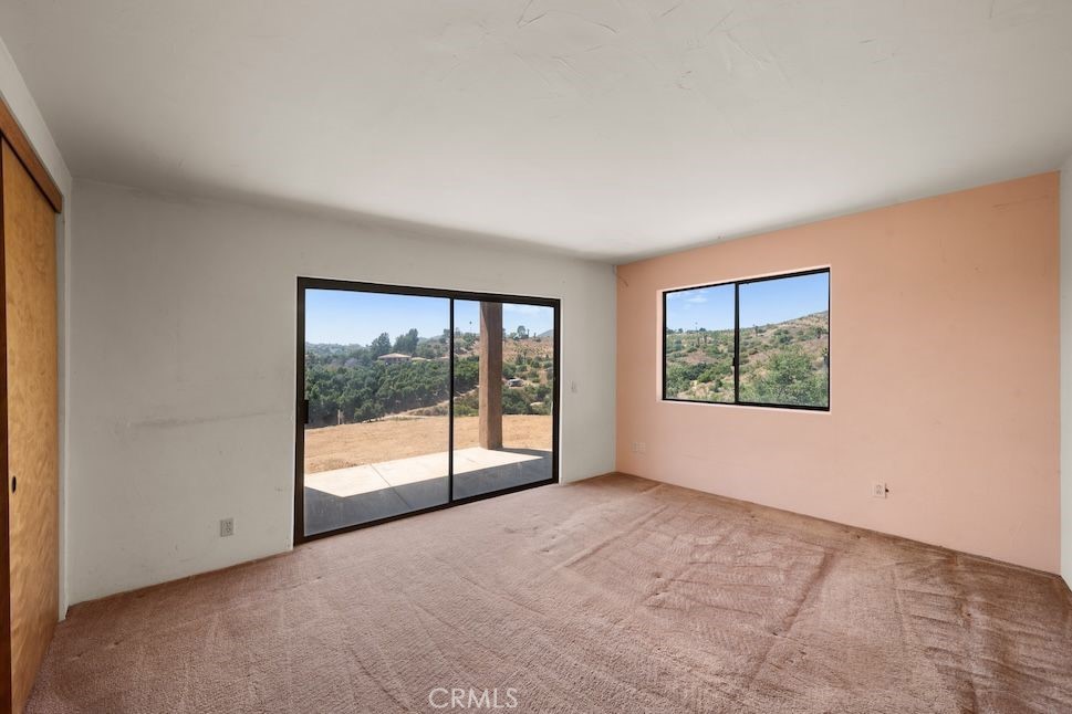 879 Stewart Canyon Road Fallbrook, CA 92028 - Photo 12 of 75 a view of an empty room with a window
