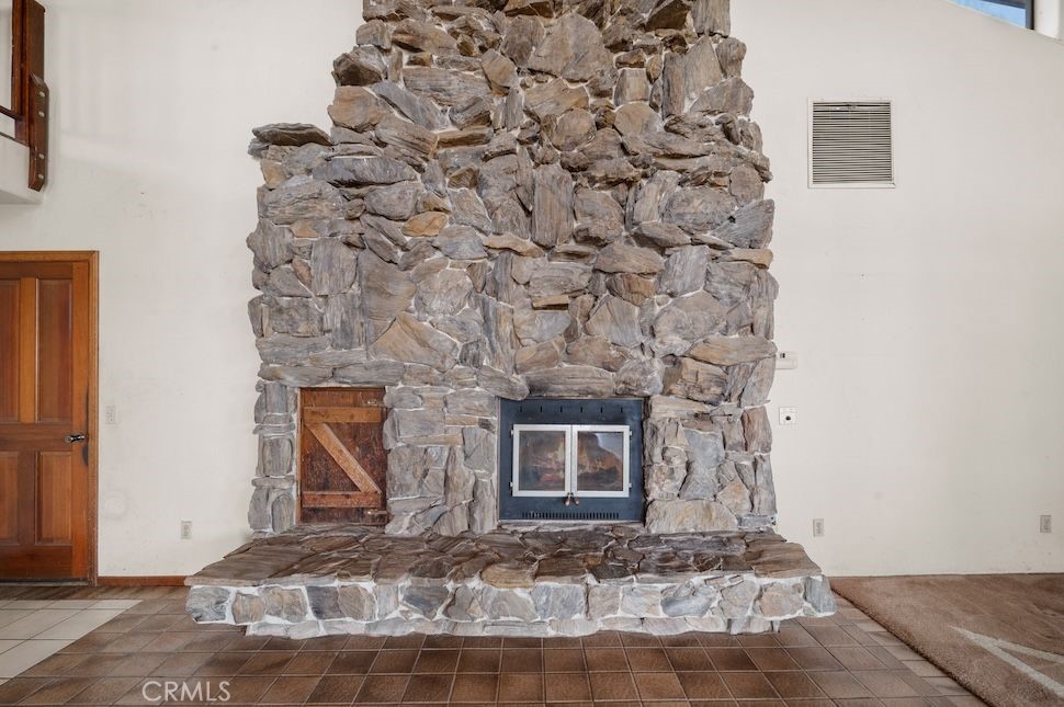 879 Stewart Canyon Road Fallbrook, CA 92028 - Photo 38 of 75 a front view of a stone house