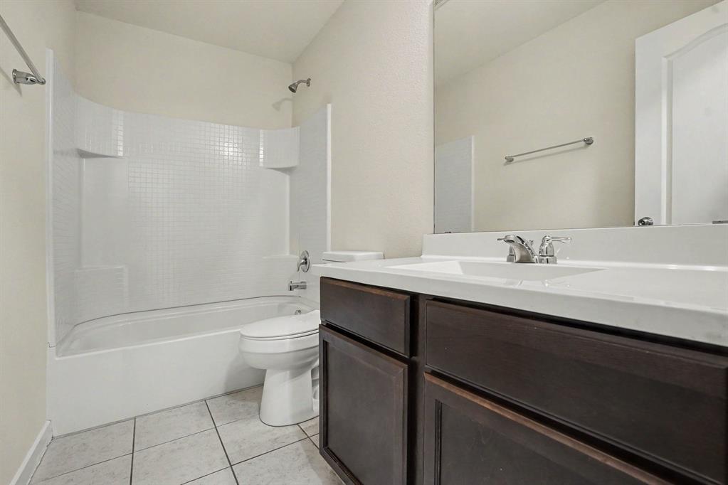 2606 Middleton Road Glenn Heights, TX 75154 - Photo 16 of 18 Bedroom 3- Recessed ceiling light fixture, neutral carpet flooring, white painted walls, and window with blinds