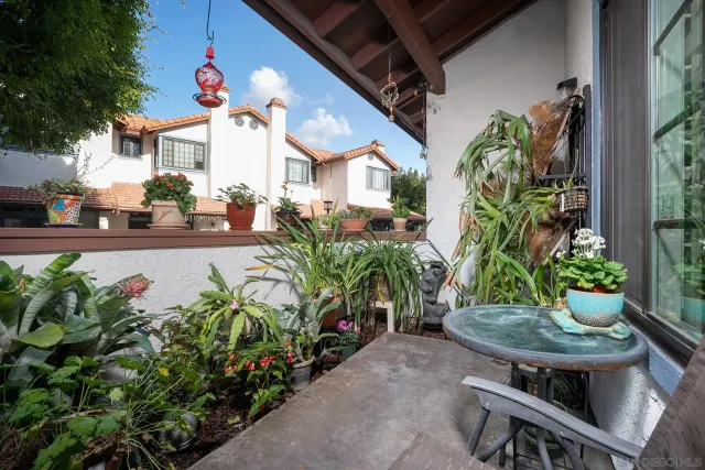 a view of a chairs and table in a patio