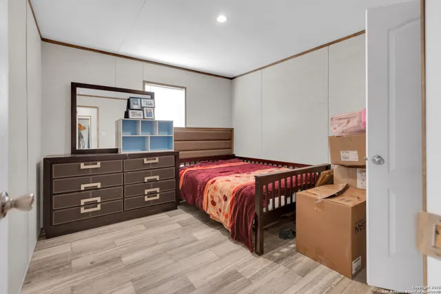 a bedroom with a bed and a dresser