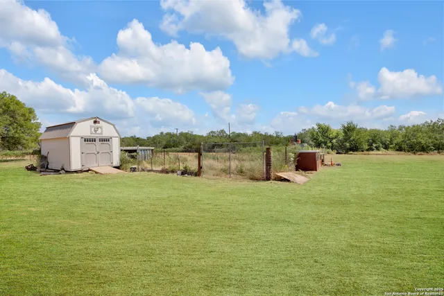 a view of a lake with a big yard