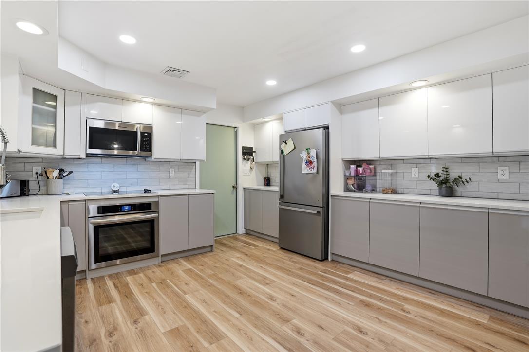 2918 Keystone Street Bethlehem, PA 18020 - Photo 12 of 54 A sleek, contemporary kitchen boasts light wood flooring and seamless cabinetry.