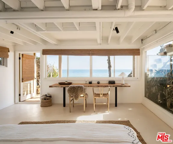 a view of a hallway with kitchen and entryway