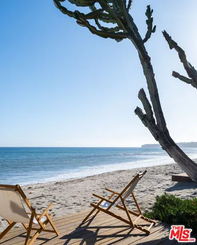 a room with pool table and chairs