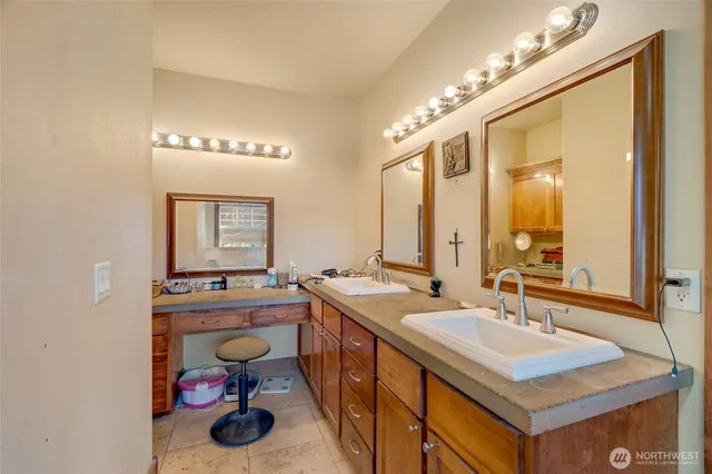 a bathroom with a sink and a mirror
