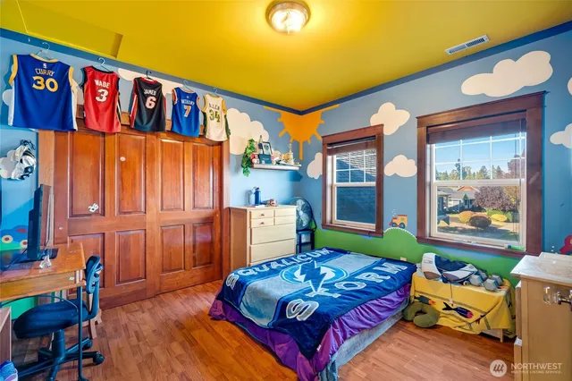 a bedroom with furniture and a window