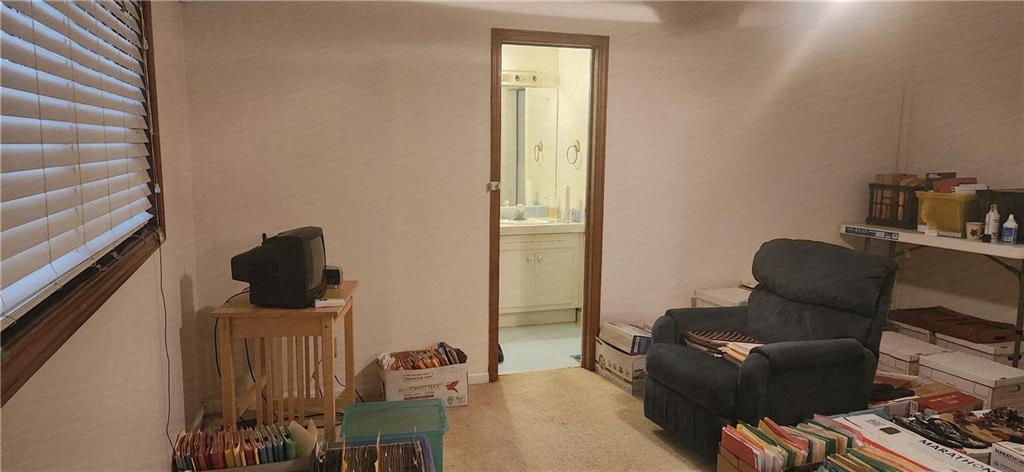 3140 Flat Shoals Road Atlanta, GA 30349 - Photo 11 of 16 a living room with furniture and a mirror