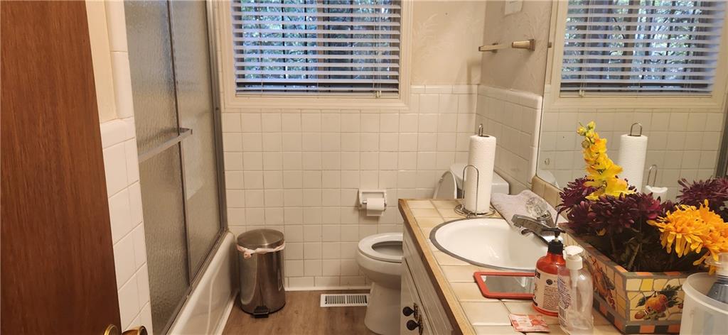 3140 Flat Shoals Road Atlanta, GA 30349 - Photo 12 of 16 a bathroom with a sink and a mirror