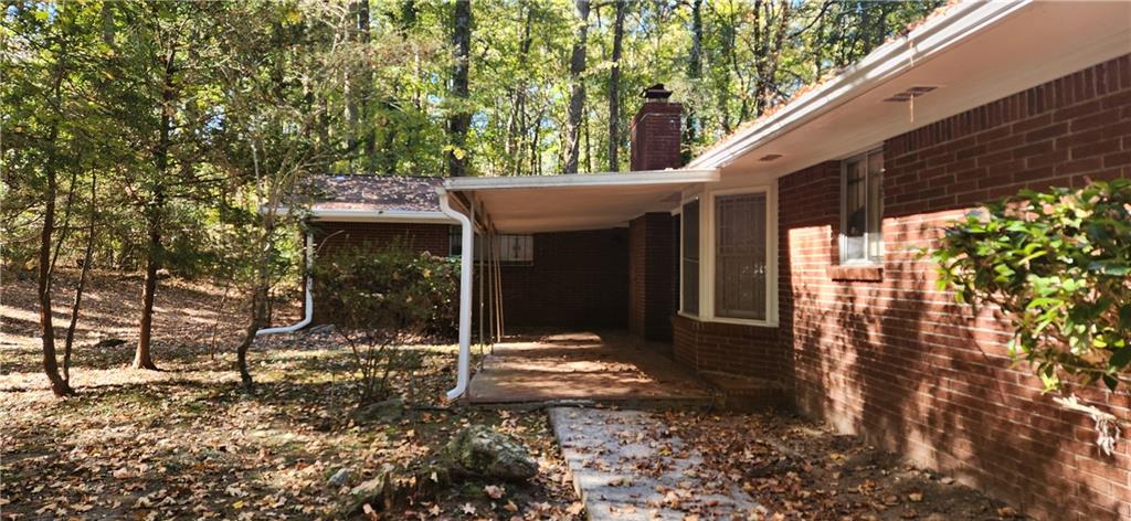 3140 Flat Shoals Road Atlanta, GA 30349 - Photo 15 of 16 a view of a small house with a tree in front of it