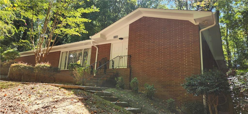 3140 Flat Shoals Road Atlanta, GA 30349 - Photo 2 of 16 a view of a house with a yard