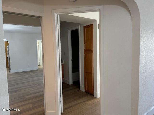 3825 East Camelback Road, Unit 226 Phoenix, AZ 85018 - Photo 11 of 20 a view of a hallway with wooden floor