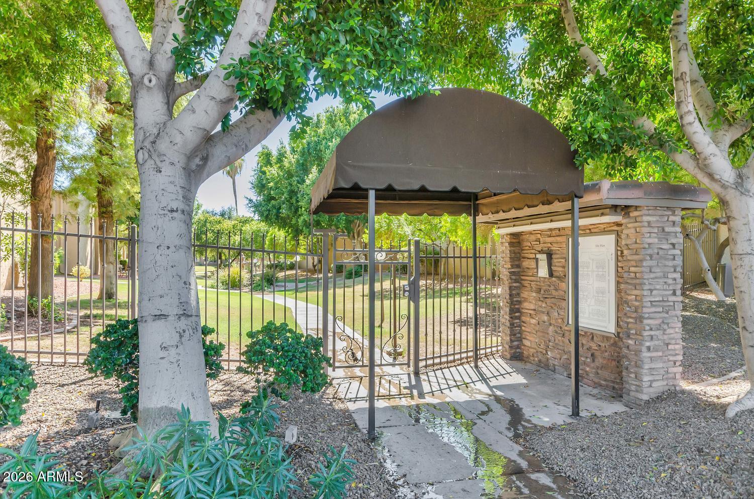 3825 East Camelback Road, Unit 226 Phoenix, AZ 85018 - Photo 2 of 20 a house view with a garden space