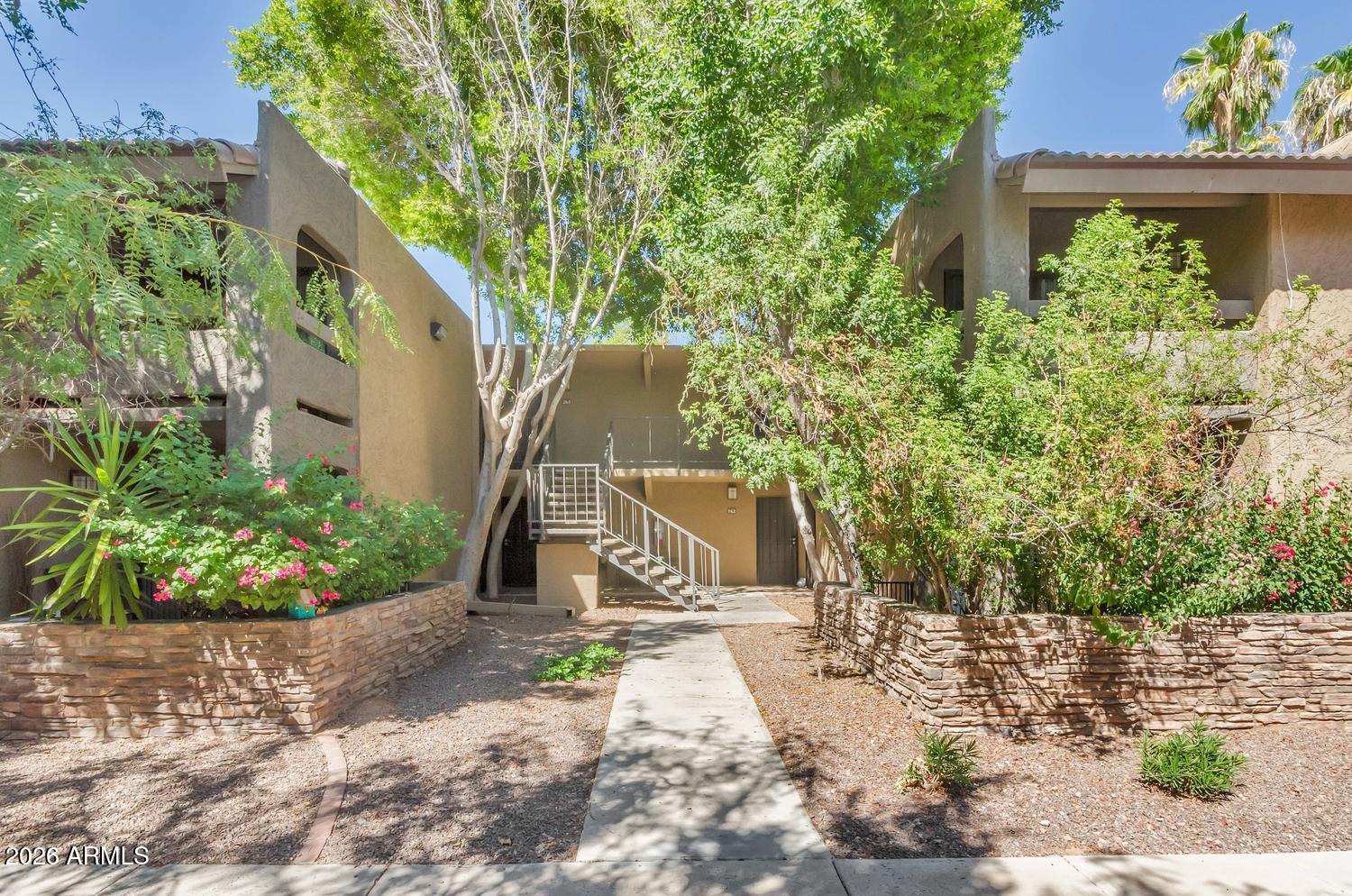 3825 East Camelback Road, Unit 226 Phoenix, AZ 85018 - Photo 5 of 20 a view of a garden with a fountain
