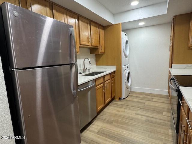3825 East Camelback Road, Unit 226 Phoenix, AZ 85018 - Photo 7 of 20 a kitchen with stainless steel appliances granite countertop a refrigerator a sink and a stove
