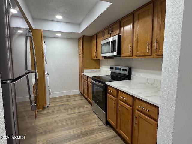 3825 East Camelback Road, Unit 226 Phoenix, AZ 85018 - Photo 8 of 20 a kitchen with stainless steel appliances granite countertop a refrigerator a stove top oven a sink and dishwasher