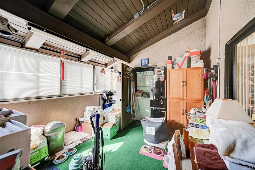 13556 La Jolla Circle, Unit 208H La Mirada, CA 90638 - Photo 18 of 39 a living room with patio furniture and a potted plant
