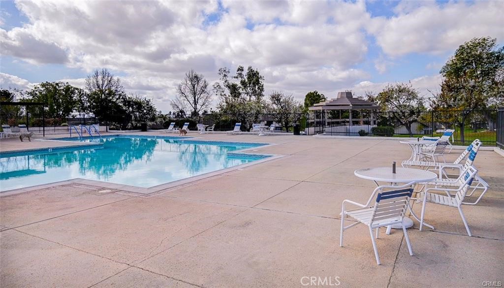 13556 La Jolla Circle, Unit 208H La Mirada, CA 90638 - Photo 32 of 39 a view of a swimming pool and lounge chairs