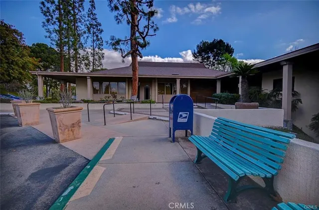 a view of a porch with chairs and backyard