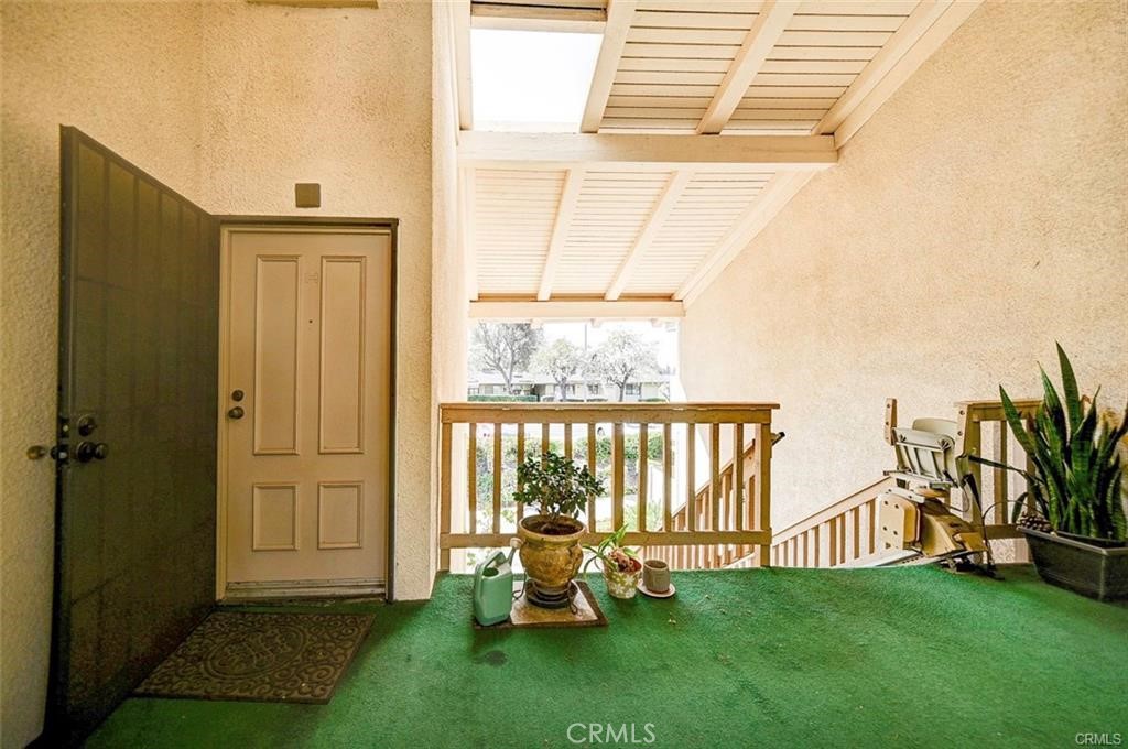 13556 La Jolla Circle, Unit 208H La Mirada, CA 90638 - Photo 39 of 39 a view of a porch with chairs and backyard
