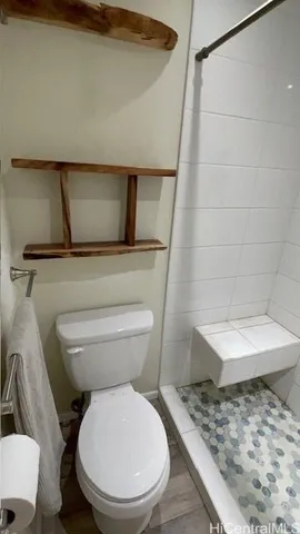 a bathroom with a toilet and a sink