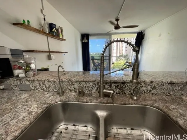 a kitchen with a sink and a window
