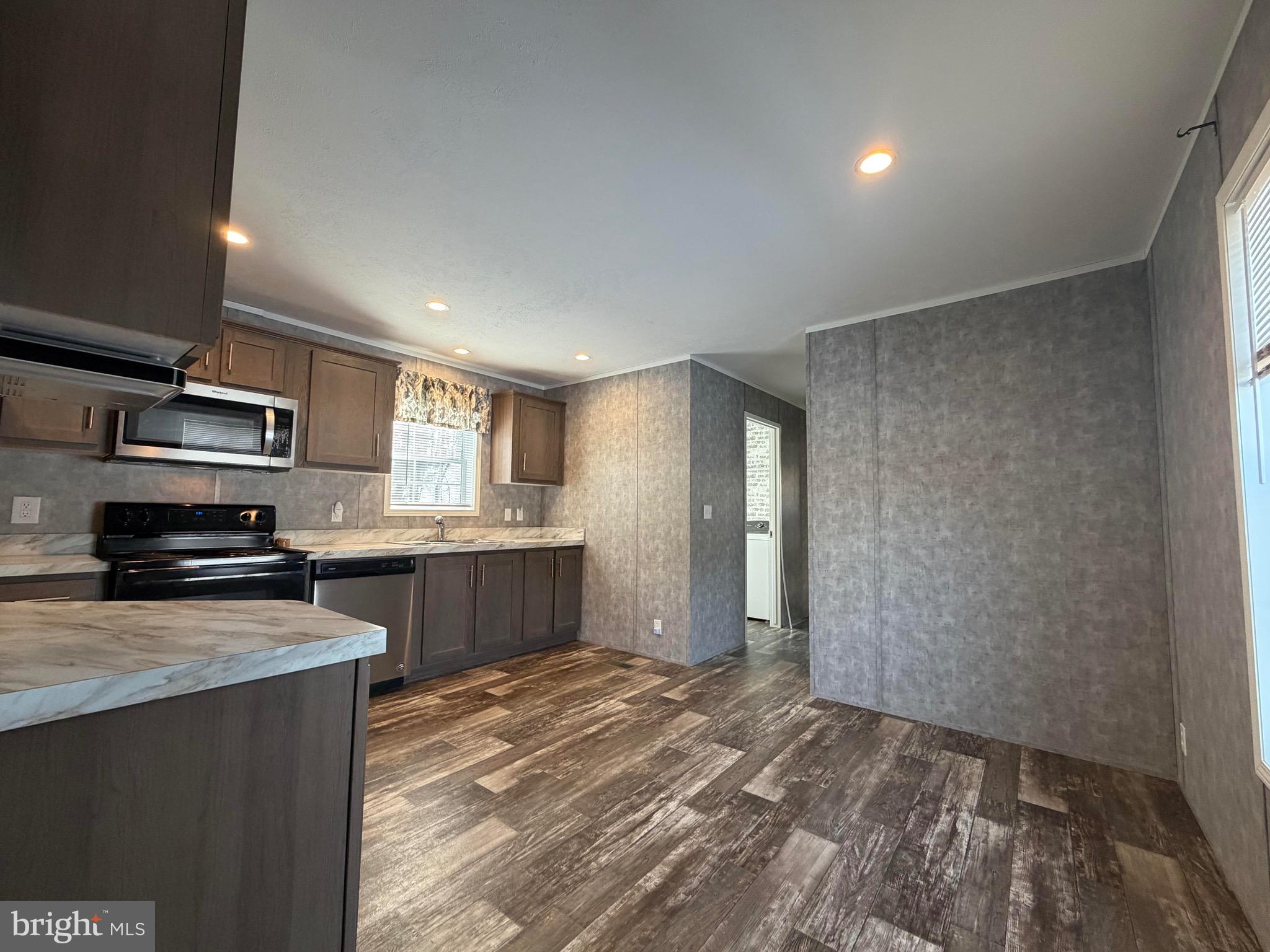 425 Cider Press Road Lock Haven, PA 17745 - Photo 17 of 38 a kitchen with stainless steel appliances granite countertop a stove a sink and a refrigerator