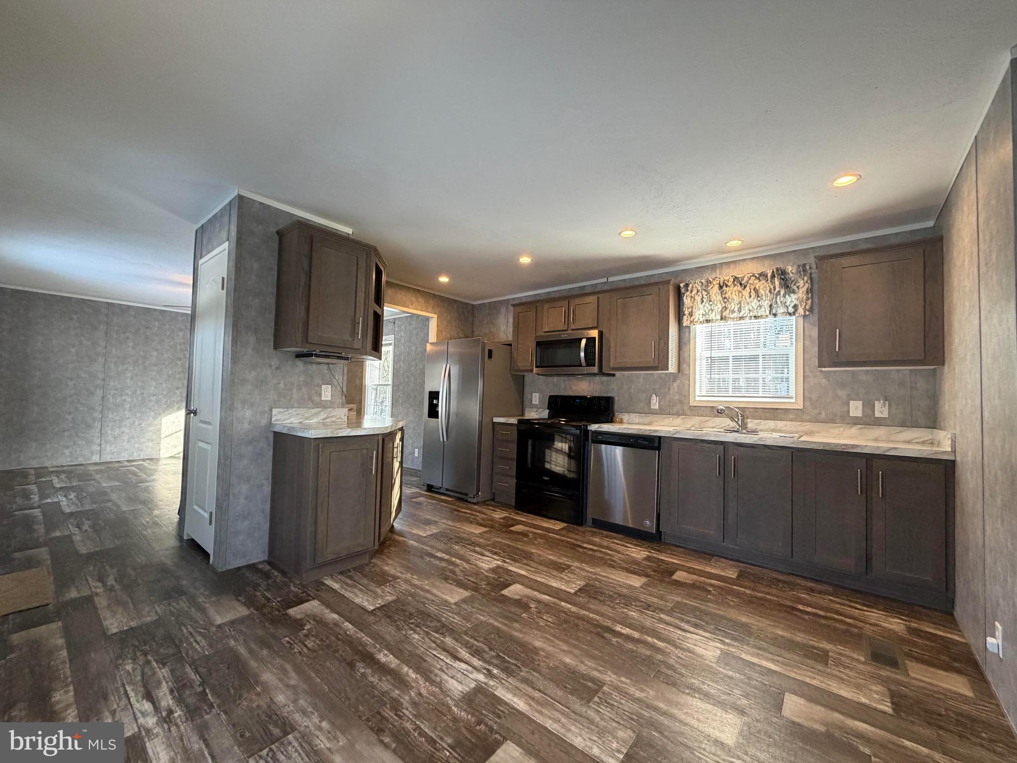 425 Cider Press Road Lock Haven, PA 17745 - Photo 19 of 38 a large kitchen with kitchen island granite countertop a sink counter top space and stainless steel appliances