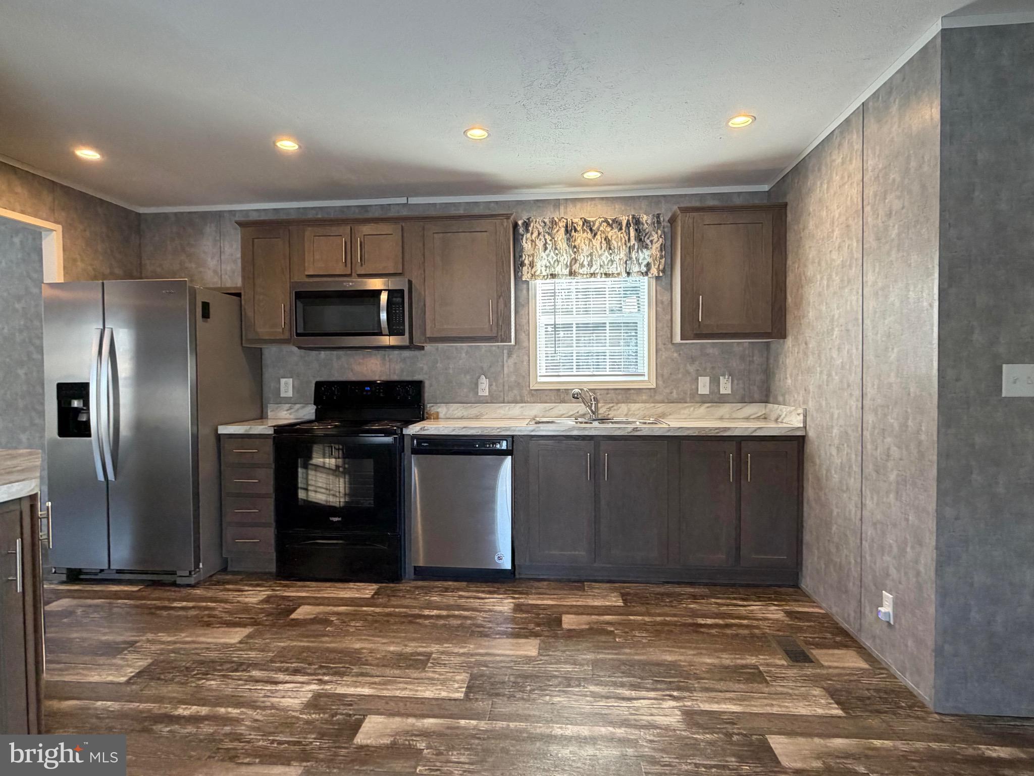 425 Cider Press Road Lock Haven, PA 17745 - Photo 21 of 38 a kitchen with granite countertop a refrigerator and a sink