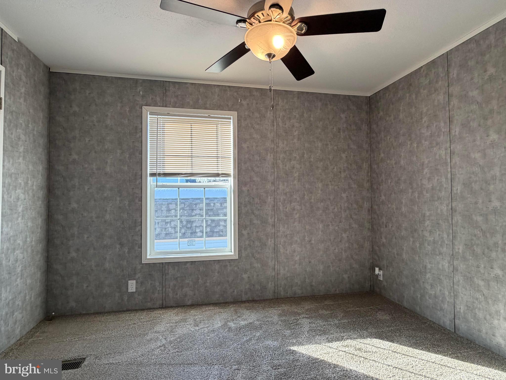 425 Cider Press Road Lock Haven, PA 17745 - Photo 24 of 38 an empty room with a window and a ceiling fan
