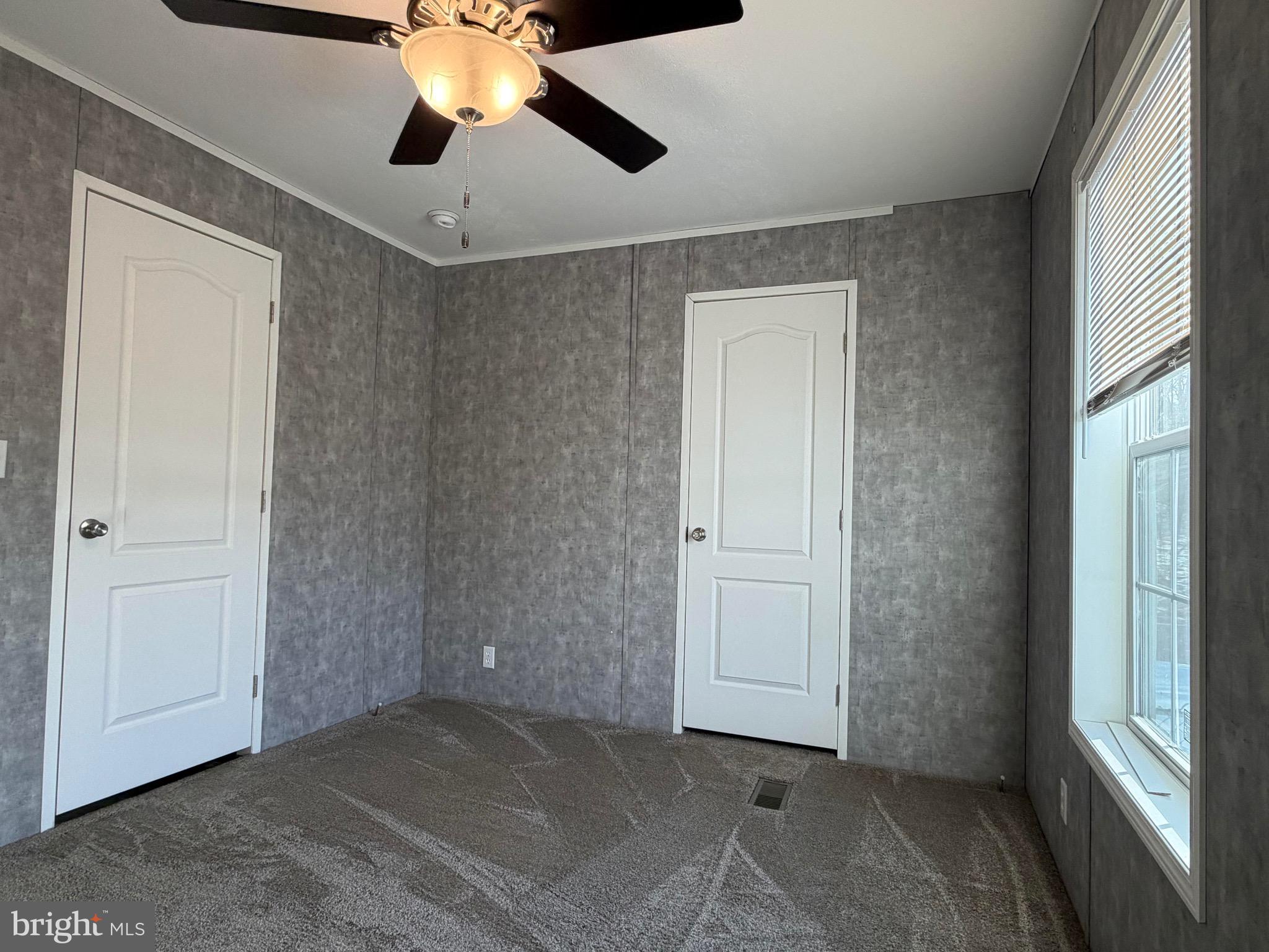 425 Cider Press Road Lock Haven, PA 17745 - Photo 25 of 38 a view of a room with a ceiling fan and a window