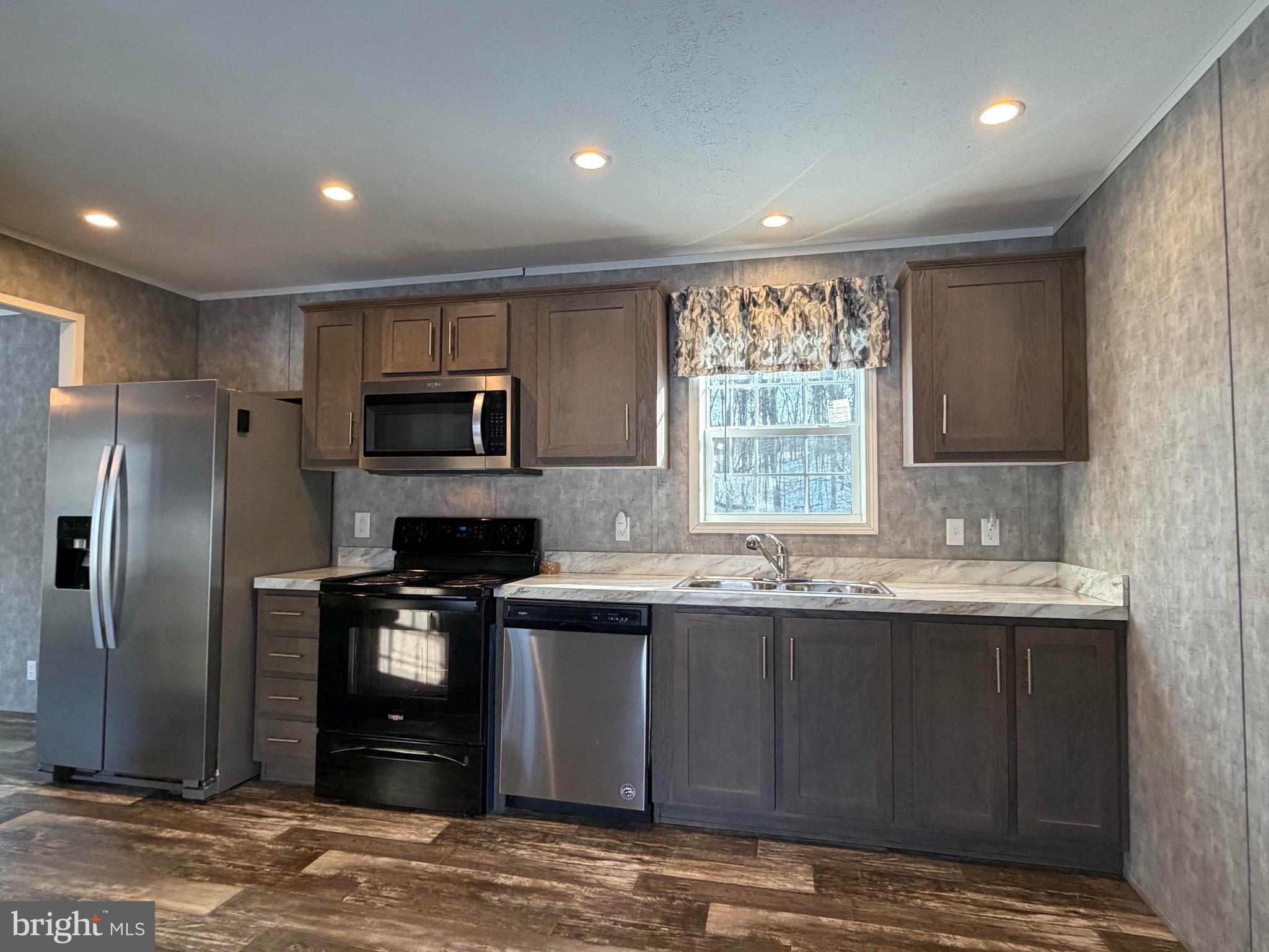 425 Cider Press Road Lock Haven, PA 17745 - Photo 29 of 38 a kitchen with stainless steel appliances granite countertop a sink stove and refrigerator