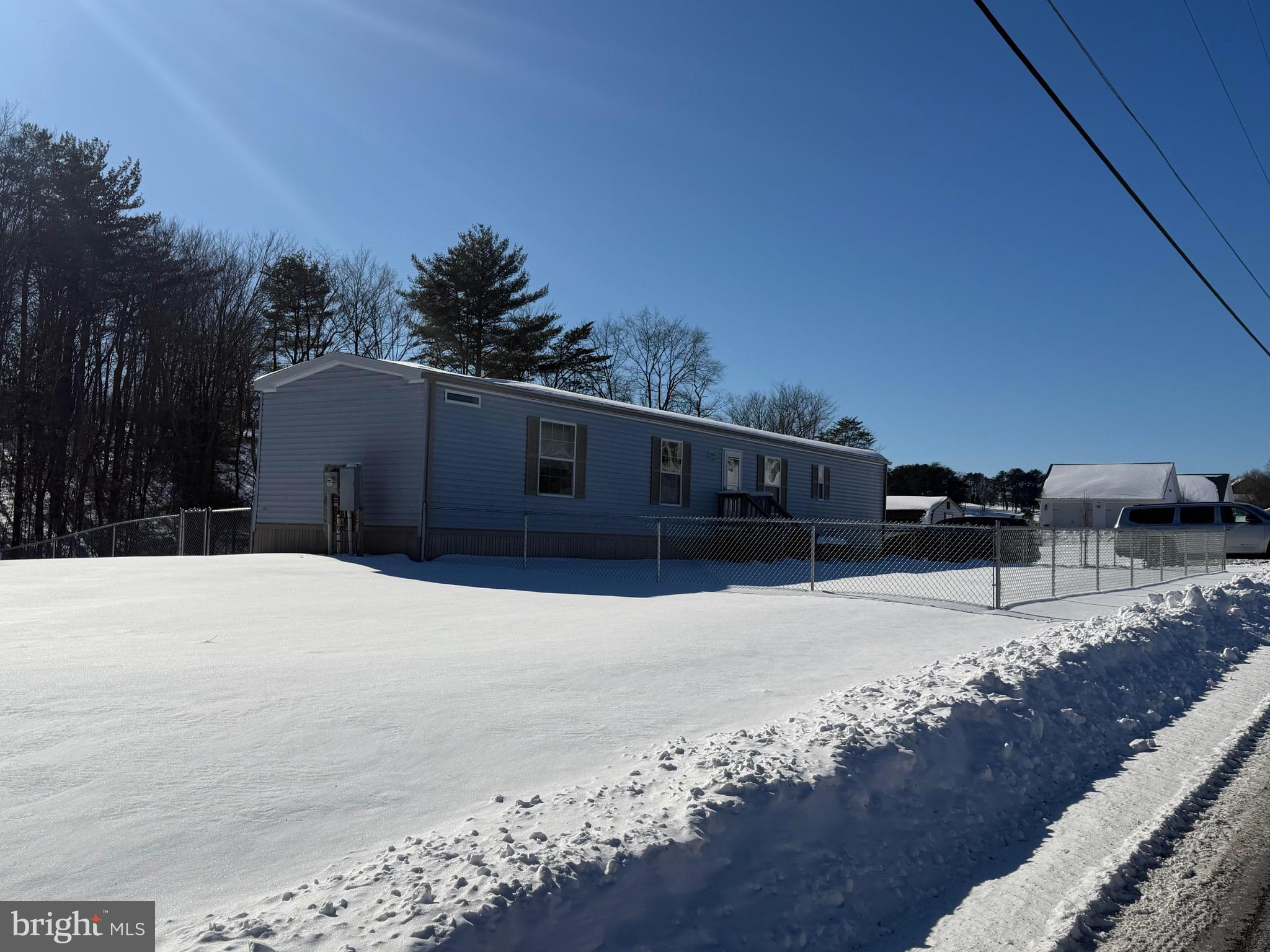 425 Cider Press Road Lock Haven, PA 17745 - Photo 4 of 38 a street view with wooden fence