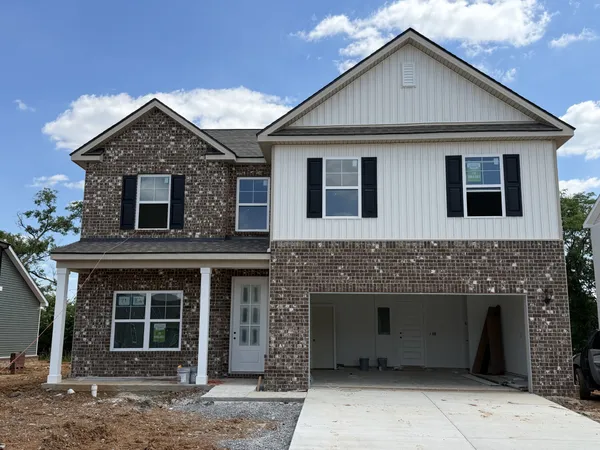 a front view of a house with a garage