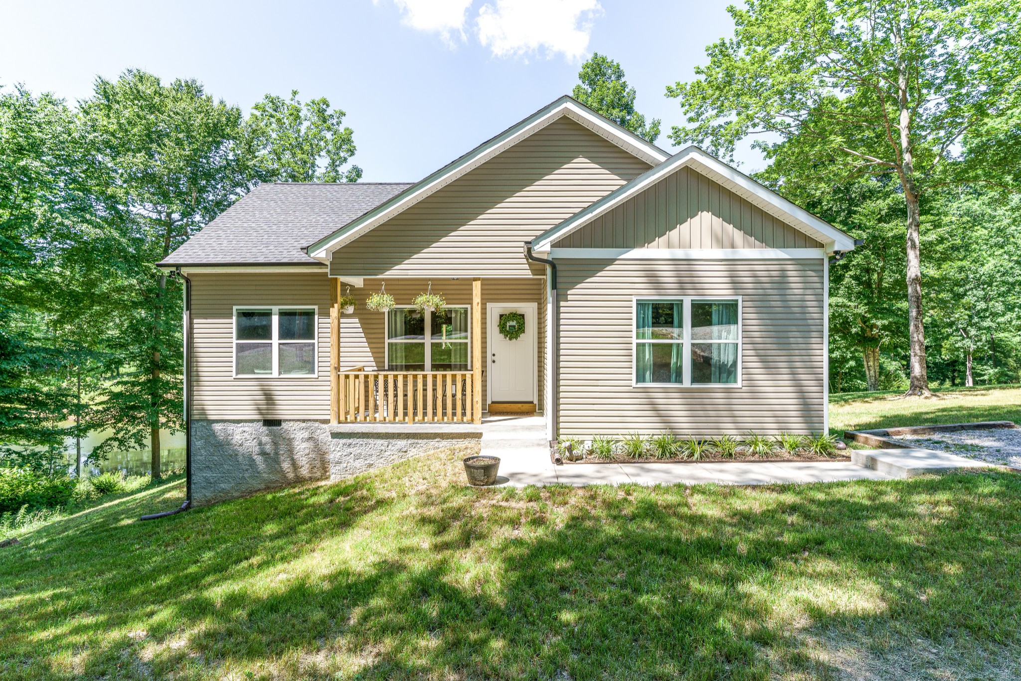 a front view of a house with a yard