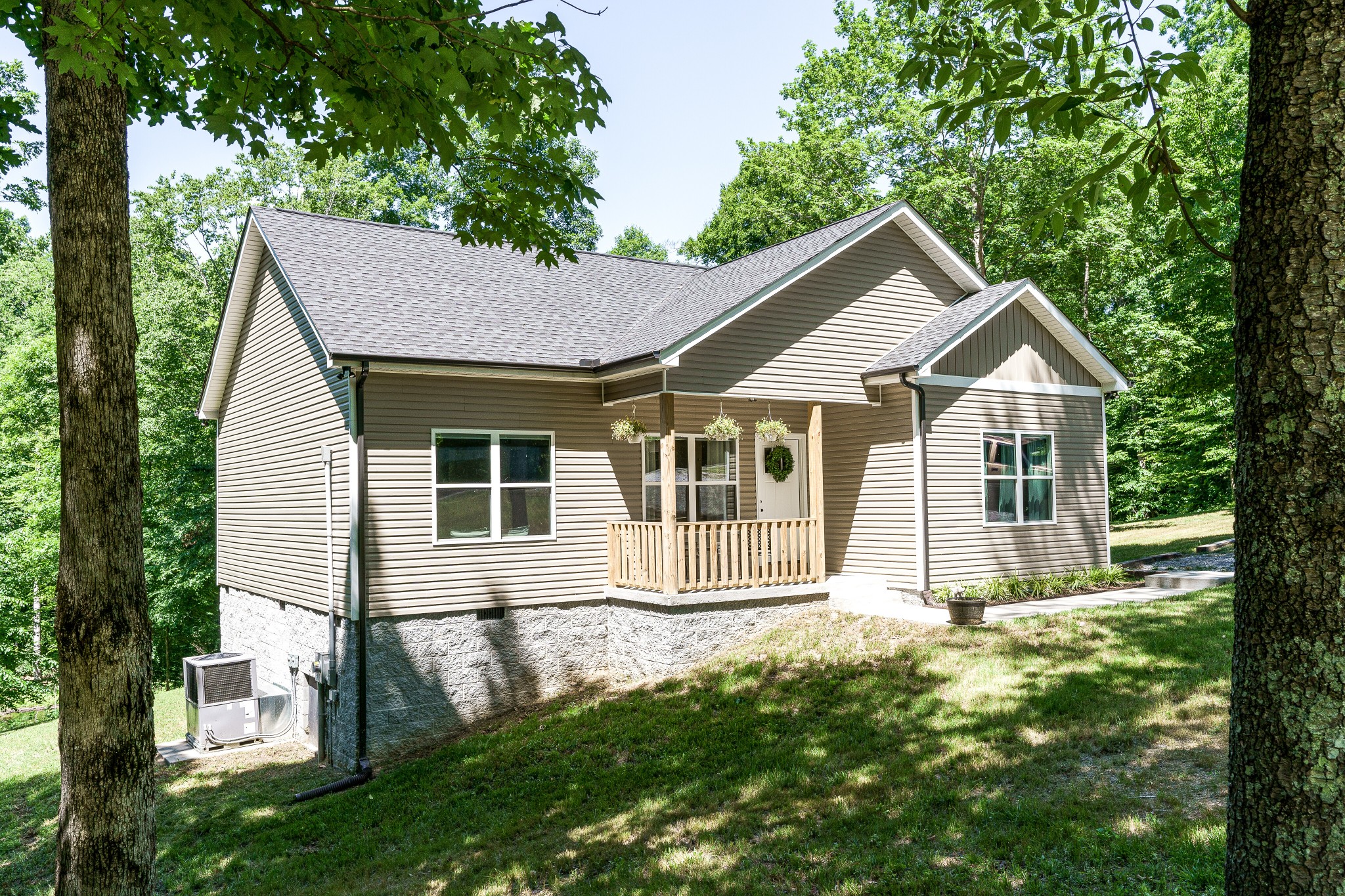 1170 Cowan Road Dickson, TN 37055 - Photo 2 of 30 a front view of a house with a garden and yard
