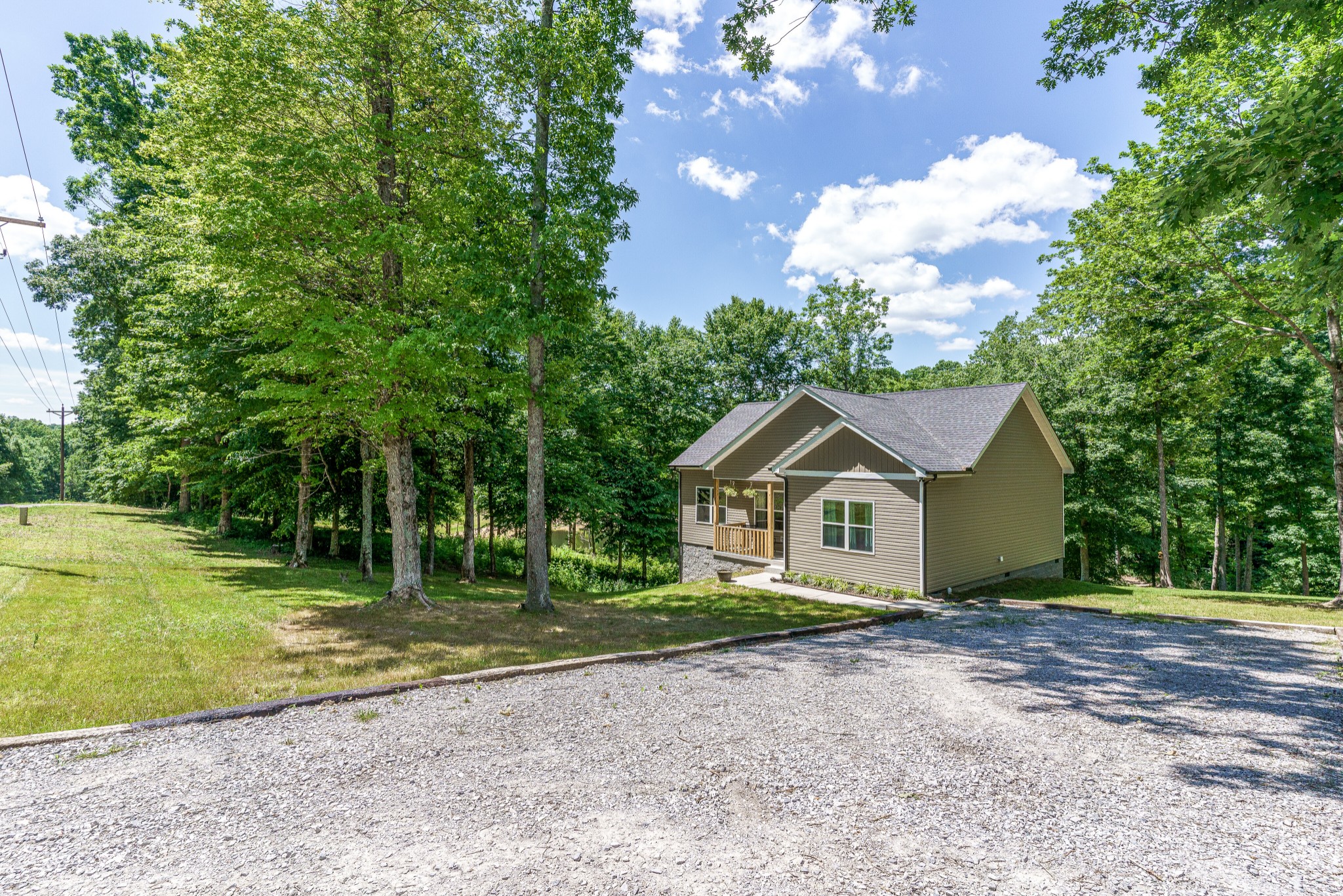1170 Cowan Road Dickson, TN 37055 - Photo 3 of 30 a front view of a house with a garden