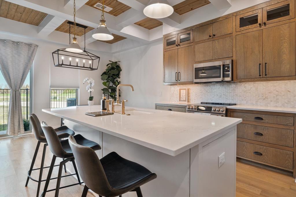 2108 Psalm Circle Heath, TX 75126 - Photo 23 of 39 a kitchen with a table and chairs in it
