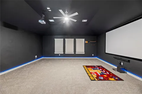 an empty room with windows and couch