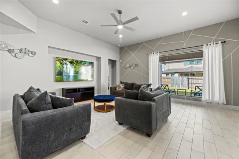 a living room with furniture and a large window