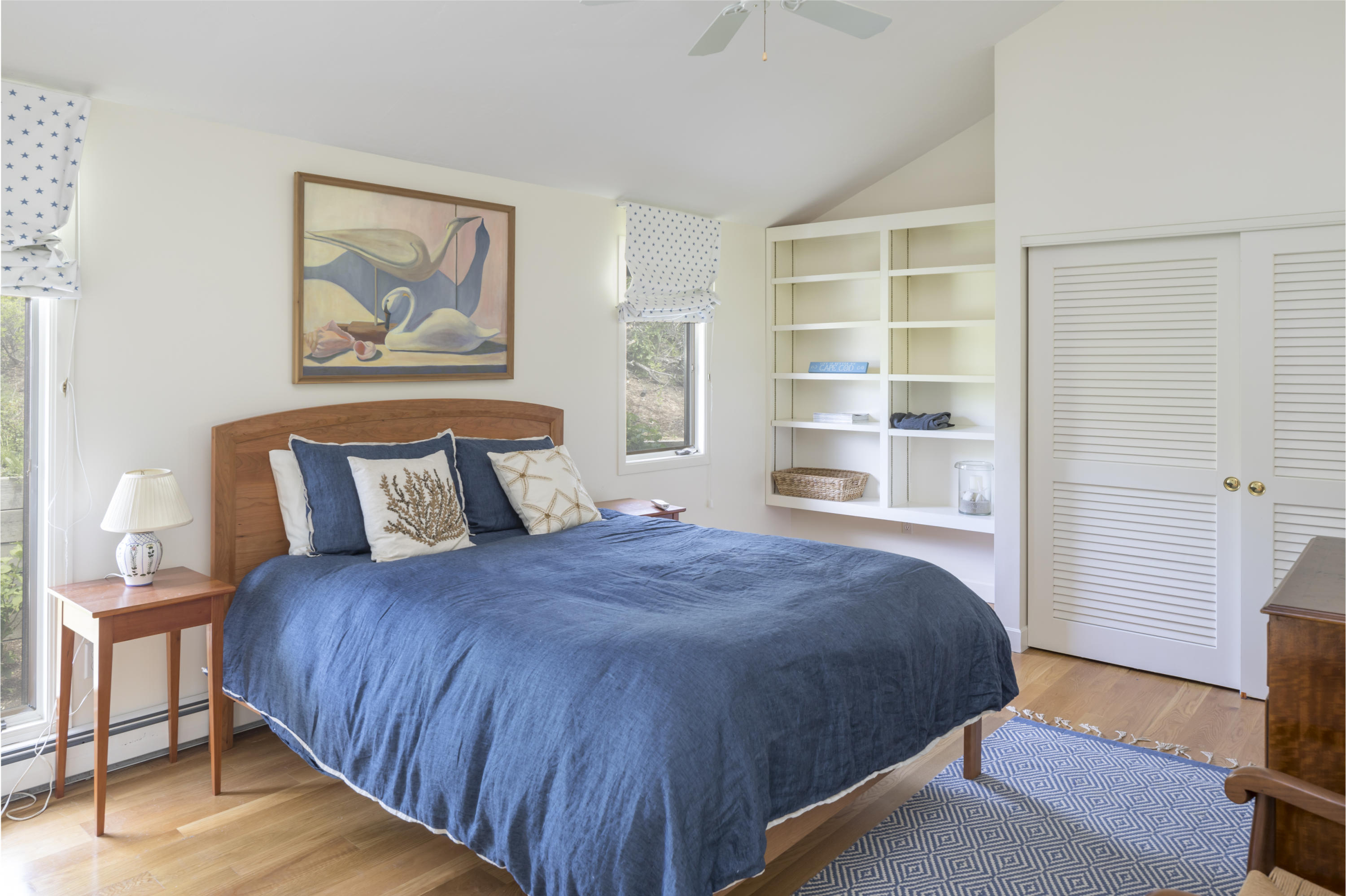 19 Avocet Road Truro, MA 02666 - Photo 17 of 26 a bedroom with a bed and a window