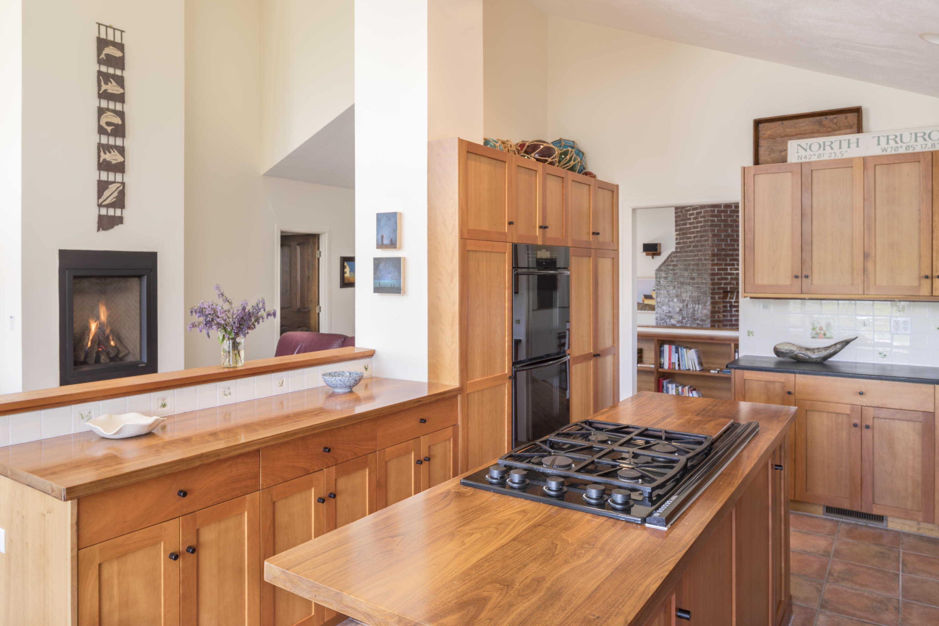 19 Avocet Road Truro, MA 02666 - Photo 5 of 26 a kitchen with stainless steel appliances granite countertop a stove a sink and a refrigerator