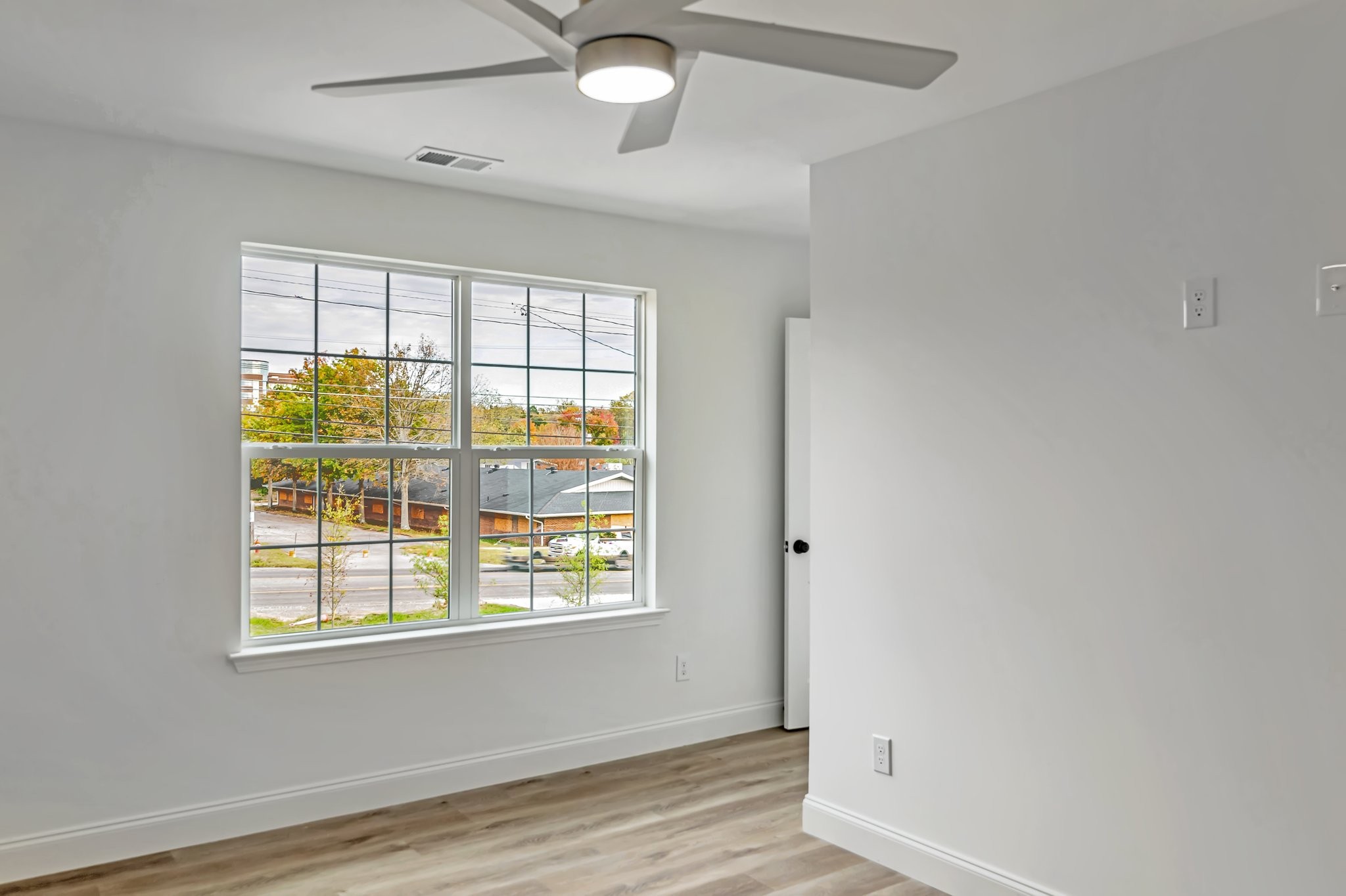 420 Larkin Springs Road Madison, TN 37115 - Photo 16 of 27 an empty room with wooden floor and windows