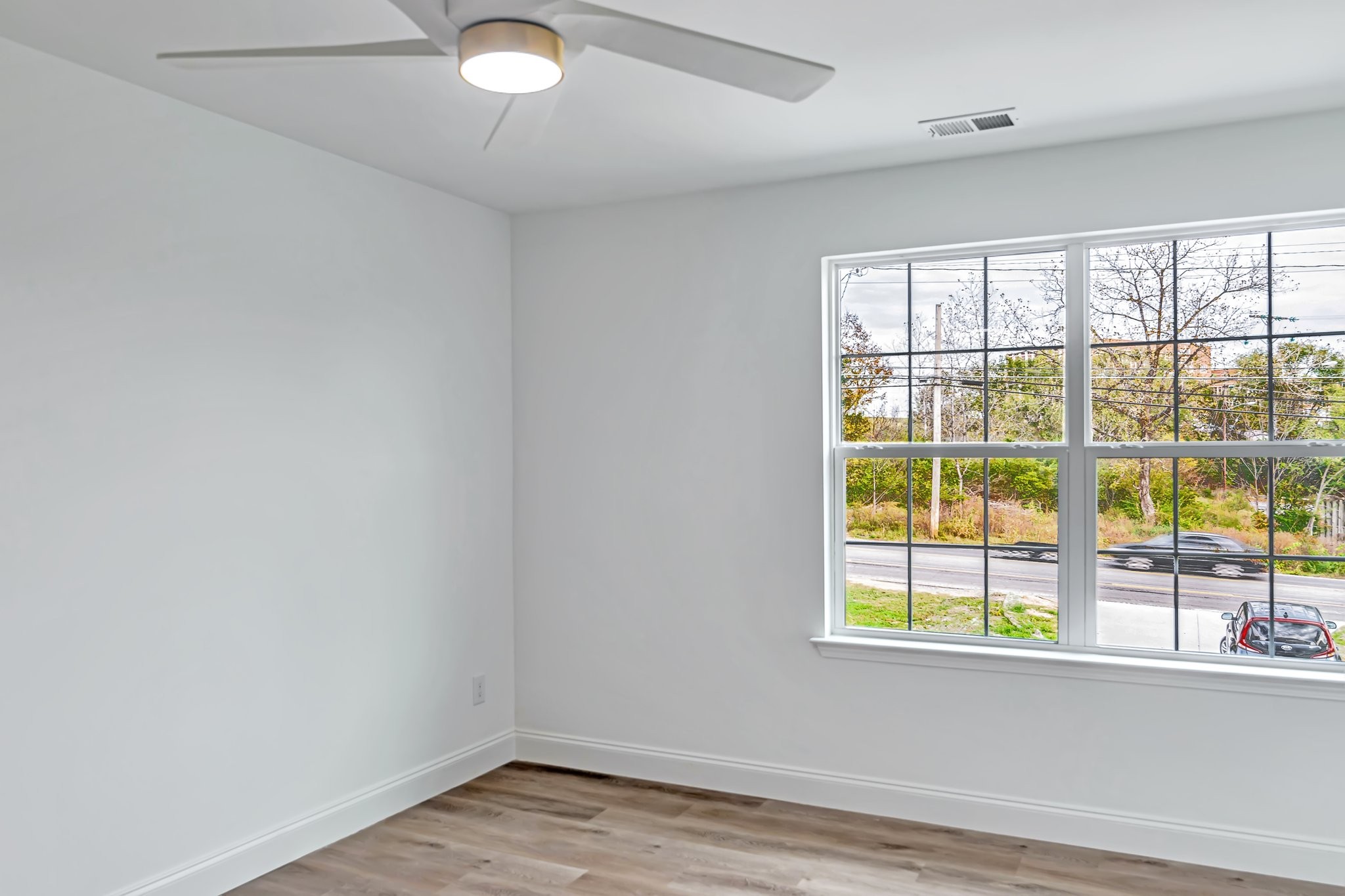 420 Larkin Springs Road Madison, TN 37115 - Photo 17 of 27 an empty room with wooden floor and windows