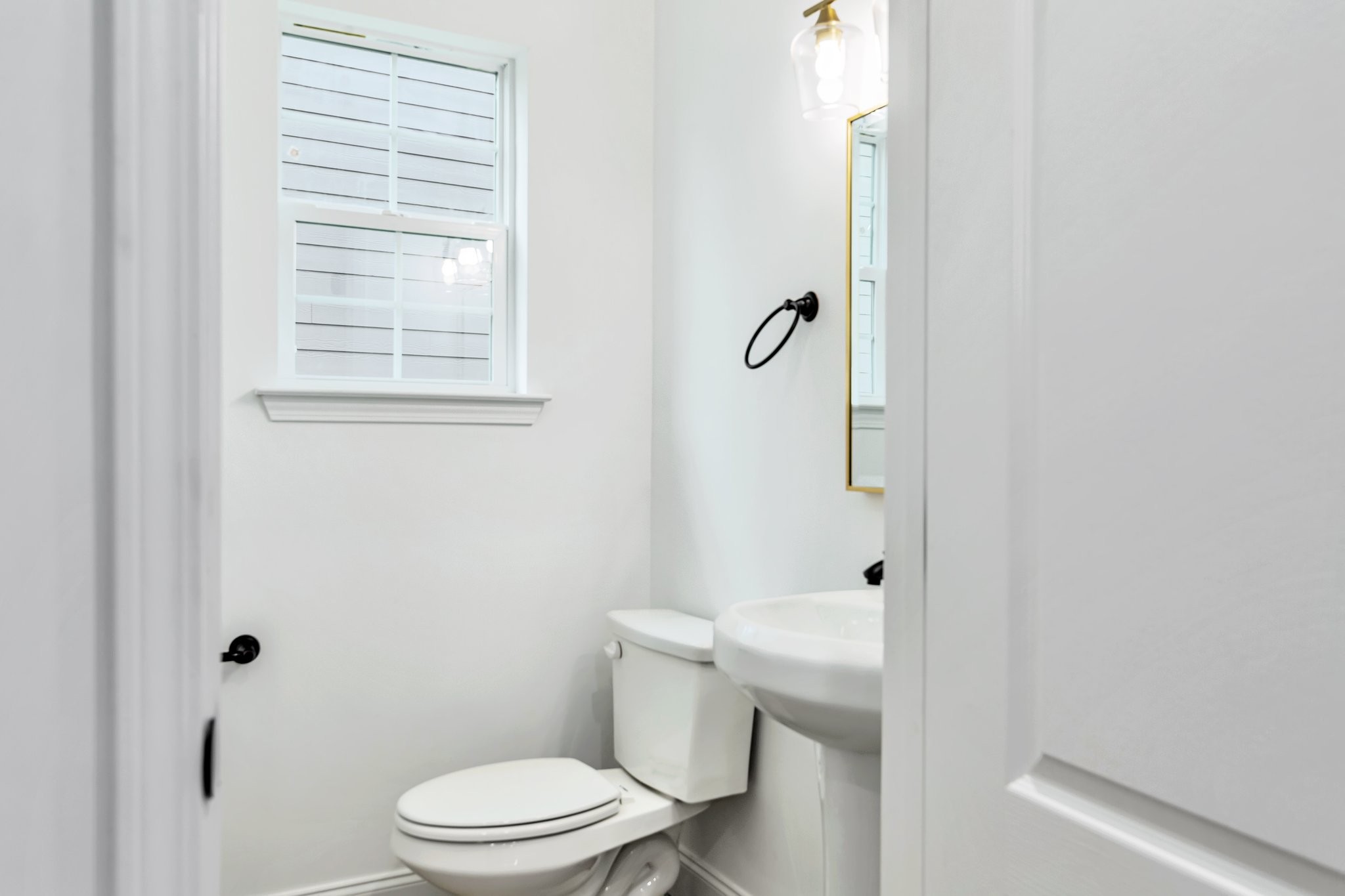420 Larkin Springs Road Madison, TN 37115 - Photo 24 of 27 a white toilet sitting next to a bathroom sink