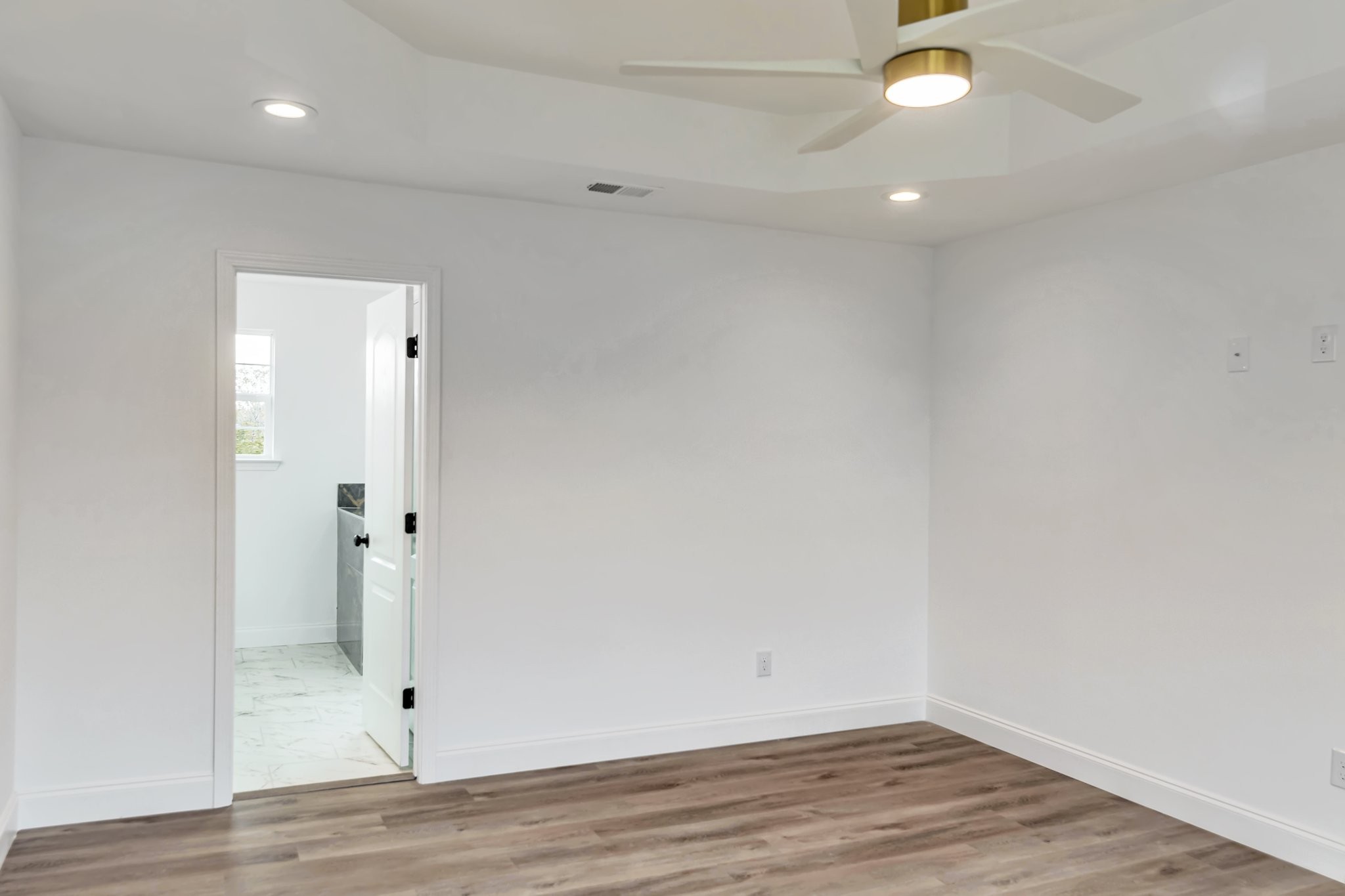420 Larkin Springs Road Madison, TN 37115 - Photo 27 of 27 an empty room with wooden floor and windows