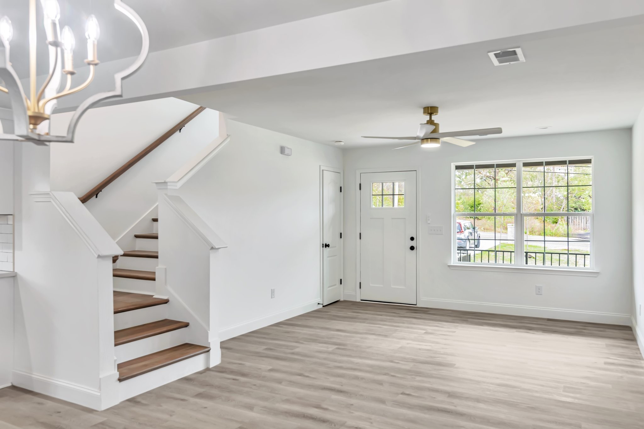420 Larkin Springs Road Madison, TN 37115 - Photo 4 of 27 a view of an empty room with wooden floor and a window